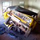 Illustration for article titled Russians Assemble A Car Inside A Tiny Room And Then Try Extracting It Through A Window